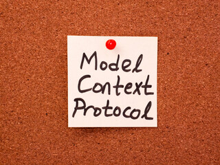 Handwritten model context protocol note on cork board