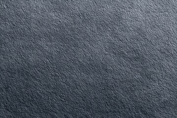 Close-up of dark textured surface with subtle patterns