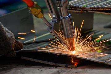 Close up scene the laser welding process by hand held laser welding machine