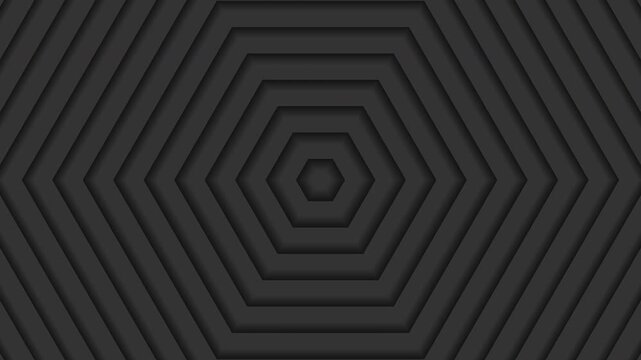 Abstract dark gray animation featuring a layered hexagonal pattern that expands outward in a smooth, continuous motion. The geometric shapes appear to rise and spread, creating a subtle 3D illusion.