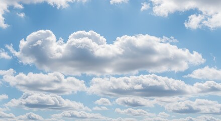 White Cumulus Clouds Against a Bright Blue Sky in Daytime Scenic View