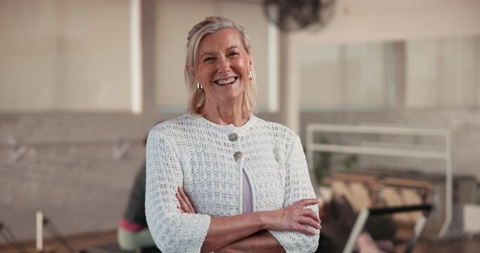 Face, mature and woman with arms crossed in gym, we are hiring or sport membership at health club. People, confident an entrepreneur at fitness studio, join us or physical training for body wellness - Powered by Adobe