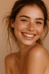 Smiling woman with natural makeup, freckles, and healthy clean skin, expressing happiness and joy in beauty portrait