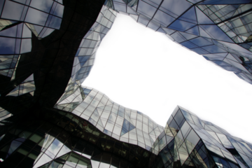 A building with a large window and a reflection of the sky