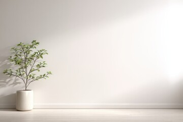 Obraz premium Minimalist indoor plant against a bright white wall creating a serene and fresh atmosphere in modern interior design