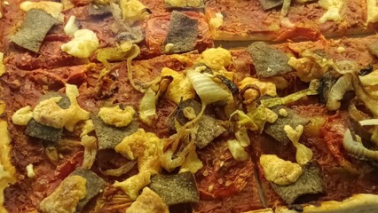A giant, square-shaped pizza sold in a cafe in Yogyakarta