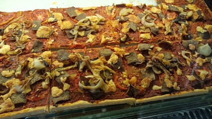 A giant, square-shaped pizza sold in a cafe in Yogyakarta