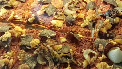 A giant, square-shaped pizza sold in a cafe in Yogyakarta