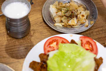 Making raw meatballs ( Turkish: Cig Kofte ) on wooden background	