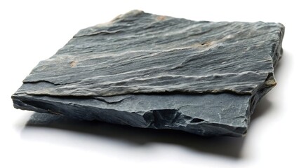 A textured piece of dark green slate rock with visible layers and mineral veins on a white background