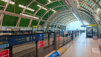Bekasi, Indonesia &ndash; October 5, 2025: View of LRT Station Cikunir 1 tunnel construction arch steel and railway from platform.