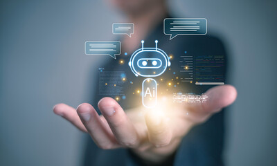 Businessman holding virtual AI chatbot icon with glowing light, representing artificial intelligence, digital assistant, automation, and technology innovation concept. Smart AI agent