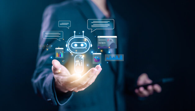 Businessman holding digital AI chatbot icon with data analytics and chat bubbles, representing artificial intelligence, automation, virtual assistant, and customer support technology.