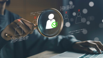CRM human resources management concept with magnifying glass focusing on selected employee icon and digital check mark, symbolizing candidate screening, recruitment.