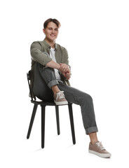 Man in stylish jeans on chair against white background