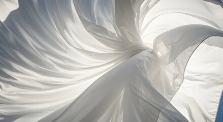 Obraz premium Delicate White Fabric Swirling Gracefully Against Bright Backdrop Highlighting Soft Movement and Texture