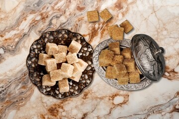 Ramadan concept, sugar in muslim bronze plate