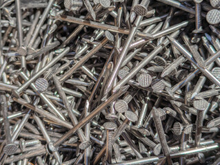 Close-Up of Shiny Metal Nails Piled Together at a Construction Site