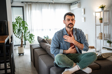 Fototapeta premium Man practicing mindful breathing for inner peace and calm