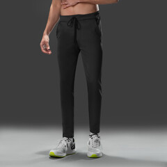 Fit young man wearing sportswear standing in studio