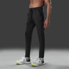 Fit young man wearing sportswear standing in studio