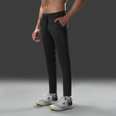 Fit young man wearing sportswear standing in studio