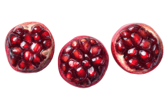 Three pomegranate halves, vibrant red,  top view