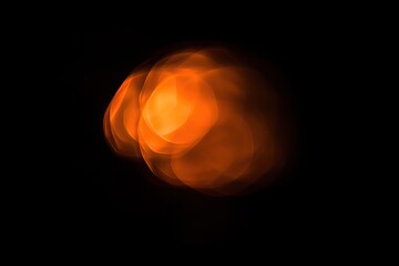 Abstract orange light leak. Bokeh effect, lens flare, and overlay isolated on a black background.