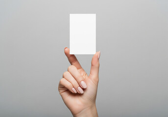 Blank Business Card or Invitation Held by a Woman's Hand.