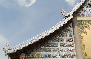Carved gold roof of church in Wat Sridonmoon, Chiang Mai Province, Northern Thailand.