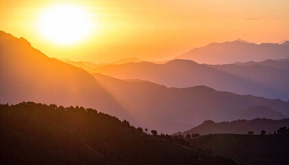 Fototapeta premium Golden Sunset Over Misty Mountain Ranges with Natural Light and Layers of Hills and Trees in Warm Orange and Blue Hues