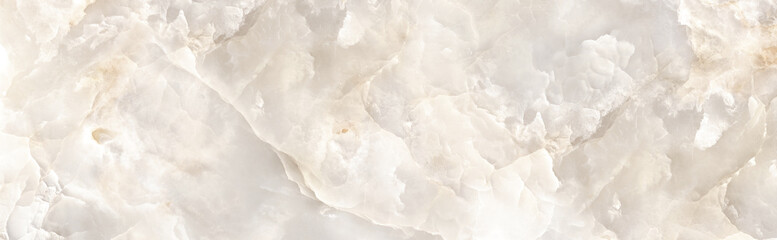 Beige onyx marble texture with translucent natural layers and soft light reflections