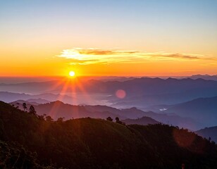 Golden Sunrise Over Misty Mountain Range Landscape with Vivid Orange Sun Rays and Hilly Horizon Scenery in Early Morning