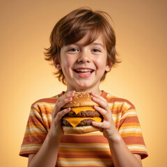 Cheerful child holds delicious cheeseburger with melted cheese, showcasing joyful expression against warm orange background