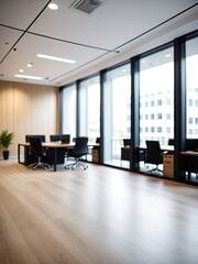 Modern office space with large windows, desks, and wood accents