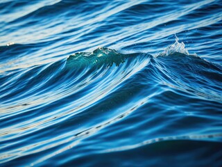 Crystal-clear water with blue waves, sunshine, and a splash