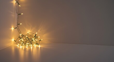 Glowing christmas led lights tangled in pile. Holiday festive decoration concept for celebration and joy. Warm light for christmas event.