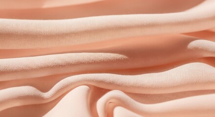 Soft Peach Fabric Folded in Close Up with Gentle Lighting