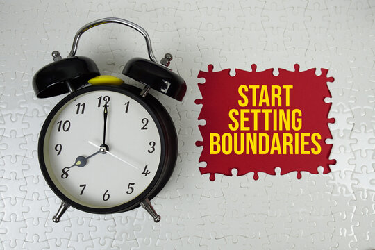Jigsaw puzzle with a missing piece with "Start Setting Boundaries" and alarm clock on red background