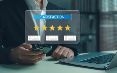 Businessman using smartphone and laptop to evaluate customer satisfaction rating and online feedback. Concept of five-star review system, digital marketing, and customer experience improvement.