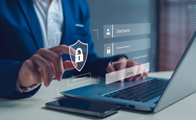 Businessman using a laptop with virtual login interface and security lock icon, representing cybersecurity, data protection, online privacy, and secure access technology for digital authentication.