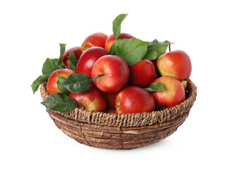 Fresh ripe apples with green leaves in wicker basket isolated on white