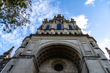 Basilica of Our Lady of Begona in Bilbao building against a vibrant blue sky.