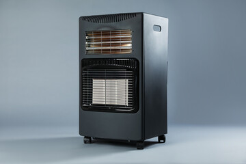 Obraz premium One electric heater on grey background. Domestic appliance