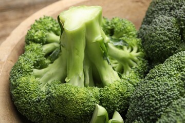 Fresh raw green broccoli in bowl, closeup