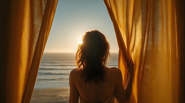 Young woman silhouette standing at window with golden curtains, looking at sunset over ocean waves, back view creating atmospheric romantic mood for lifestyle design. - Powered by Adobe