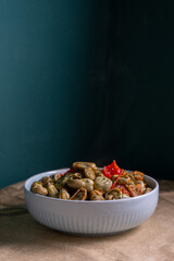 Sautéed broad beans with red bell pepper, a traditional Portuguese spring dish featuring tender fava beans, olive oil, and herbs, rich in flavor and color.