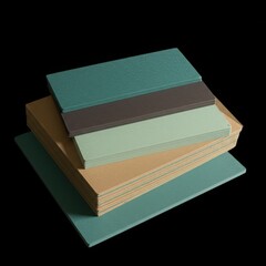 Stack of various colored abrasive sandpaper sheets and rough textured materials on a dark background