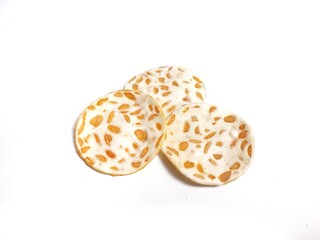 Keripik Tempe or Tempeh Chips isolated on white background with copy space. Traditional Indonesian food are made from soybeans mixed with rice flour then sliced ​​thinly. Suitable fot design element.