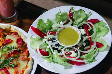 Fresh greed salad with onion and pepper